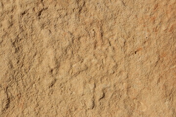 close up of yellow stone surface texture 