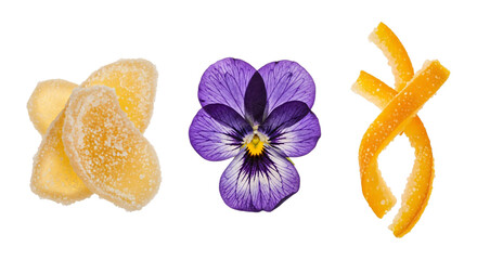 Candied ginger, pansy flower, and orange peel isolated on transparent background
