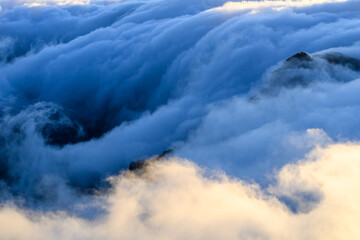 View of the dramatic clouds from Pico Ruivo mountain on the island of Madeira