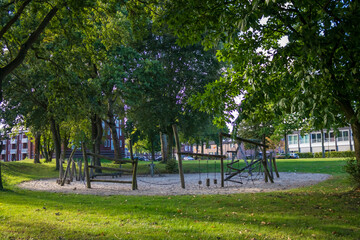 Children's playground with green grass in a residential area in the Netherlands, city of Deventer. High quality photo