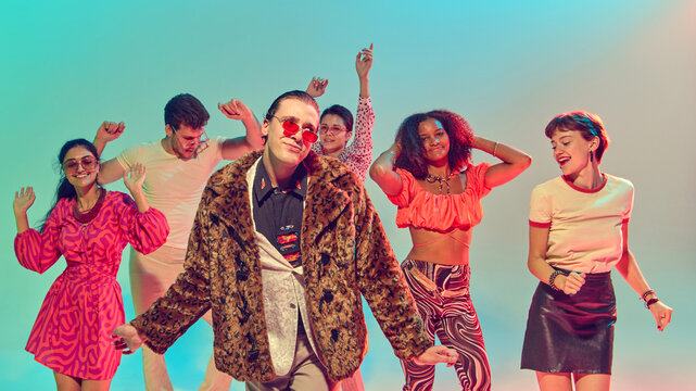 Man in leopard coat posing with friends on disco stage. Concept of retro performance, nightlife attitude, bold fashion, music energy and cultural nightlife scene.