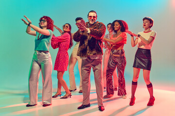 Fototapeta premium Group of stylish dancers performing synchronized disco moves. Concept of teamwork, retro culture, vibrant nightlife, collective fun and music celebration.