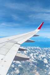 Obraz premium Awesome view of the Earth under the airplane wing