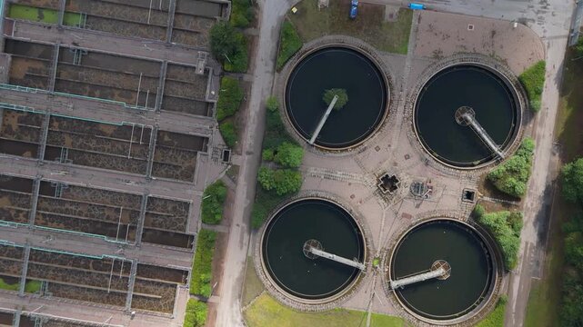 Top down view of a sewage water treatment plant facility with circular and aeration tanks, Wastewater treatment

