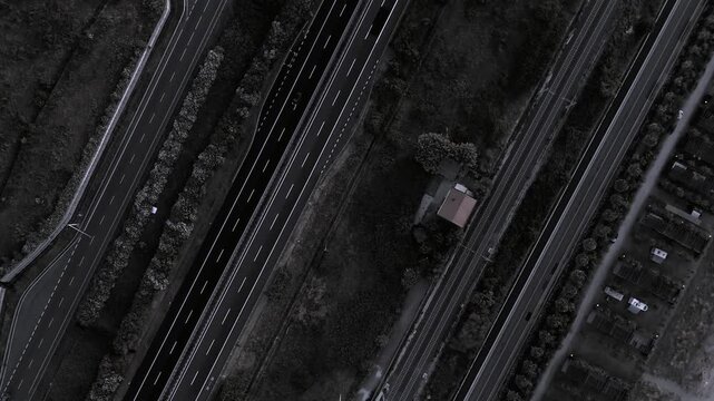 Aerial drone view of road lanes and railway crossing landscape