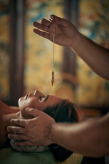 Attractive woman recieving holistic health treatment in a wellness health spa.