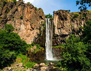 Scenic waterfall cascading down rocky cliffs