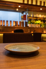 Simple dinner plates on a wooden dining table