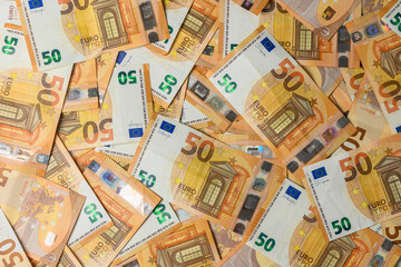 Fifty euro notes spread on table as texture