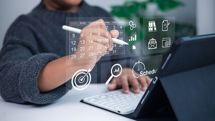 Person Using Digital Calendar and Task Management Interface for Business Planning and Workflow Efficiency