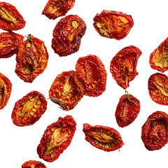 Dried tomato halves scattered.  Red, sun-dried slices of tomato.  Distinctive texture.  Close-up view