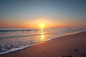 Obraz premium Scenic sunset over calm ocean waves