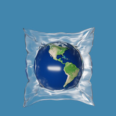 A globe wrapped in plastic wrap on a blue background