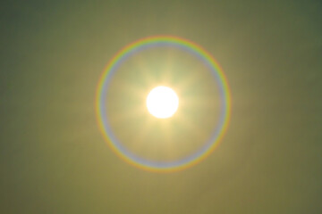 Shining sun on sunset sky with lens flare of sunlight on sky background Bright sun on golden sky Concept Nature and environment background