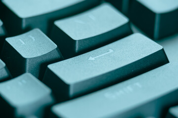 Close-up of the Enter and Shift keys on a black computer keyboard, symbolizing technology, digital communication, and modern computing