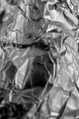 Glossy Silver Foil Abstract Texture. Glossy silver foil texture with reflective metallic shine, perfect for backgrounds, modern design, and high-quality creative visuals.