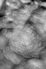 Crumpled plastic background texture with glossy folds, ideal for modern design, packaging, and digital overlays.