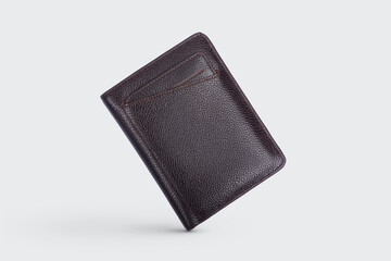 Genuine leather fashionable black wallet for men's isolated on a white background. A professional and stylish look. top view of black leather wallet. banknotes and put card inside the wallet	