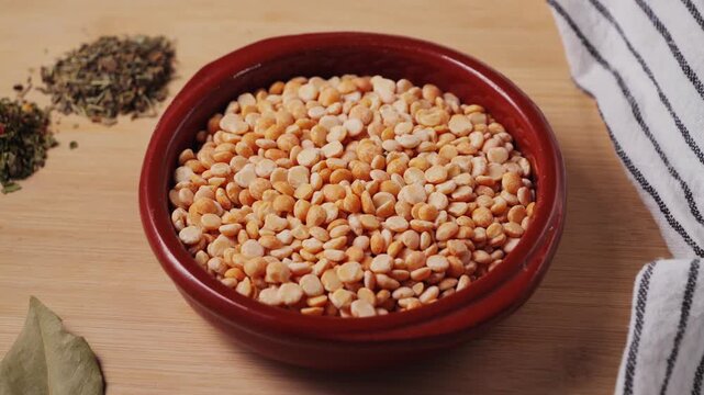 Dried yellow peas with spices close up. Healthy food concept. Healthy nutrition, vegan food. Garnish concept. High quality 4k footage