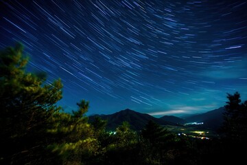Stunning natural landscape with celestial trails stretching across dark sky