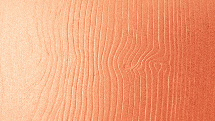 Rose gold silk fabric texture with smooth folds and shiny surface, elegant luxury background for design and decoration.
