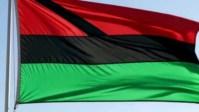 Animated Pan-African flag waving smoothly with vibrant red, black, and green colors. Perfect for Juneteenth celebrations, cultural awareness videos, and historical content