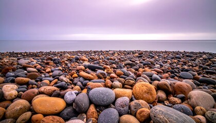 Pebble Beach Shoreline Under a Cloudy Sky.