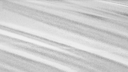 Silver foil texture with shiny metallic surface and wrinkled pattern, abstract luxury background for design and decoration.