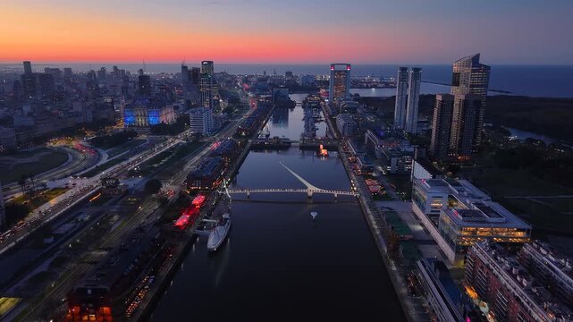 Aerial view of the "Women's Bridge" in Puerto Madero, Buenos Aires, Argentina, at sunset.