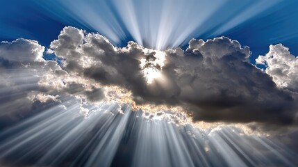 A breathtaking view of bright sunlight breaking through dark clouds, creating dramatic rays of light against a vivid blue sky. This imagery evokes a sense of hope and serenity.
