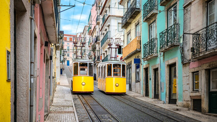 Two Yellow Trams in Colorful City Street of Lisbon, Portugal
