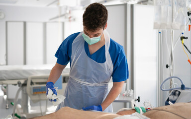 Fototapeta premium Nurse cleaning patient's skin in hospital room during medical procedure