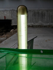 Fluorescent Tube Light Fixture at Construction Walkway.
