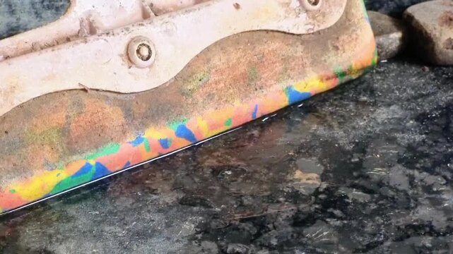 A well-used kitchen/floor squeegee (wiper) with a colorful blade, designed for effectively cleaning and drying various surfaces like kitchen platforms, tiles, and granite, ensuring quick drying.