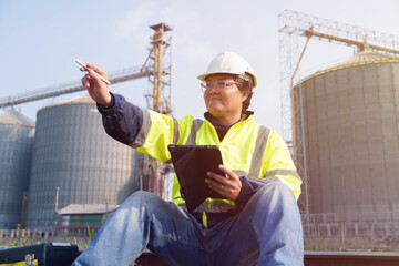 Engineers are checking the working system of a fresh food factory producing ducks, chickens and...