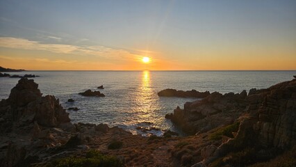 Sunset over rocky Mediterranean coast