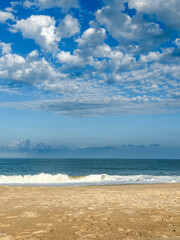 Ocean Horizon with Dramatic Sky - Tranquil Beach Scene with Blue Ocean and Puffy White Clouds