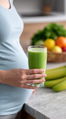 Pregnant woman hand holding green smoothie healthy drink fresh fruit kitchen counter glass cup soft light calm mood nutrition focus morning routine
