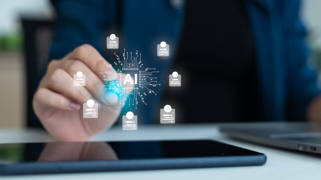 Businesswoman using tablet with artificial intelligence, AI recruitment technology, and digital HR management. Concept of automation, people analytics, hiring process, and modern business innovation.