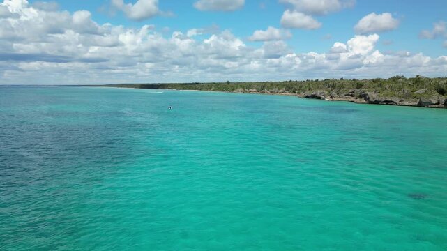 Drone footage of El Penon &mdash; emerald waters crashing against dramatic coastal cliffs