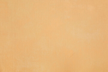 Old brown fabric surface with subtle abstract patterns