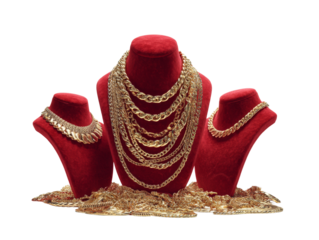 Luxurious display of gold necklaces on red velvet busts against transparent backdrop