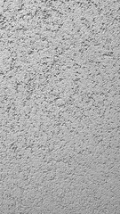 Detailed close-up of textured concrete surface in monochrome