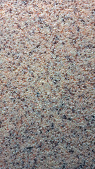 Close-up of speckled granite texture with natural earth tones