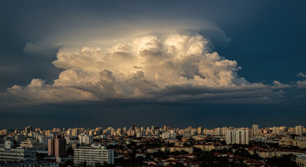 Cityscape under dramatic storm clouds