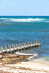 A jetty into the Indian Ocean on the white sand beach at Gnarabup, Prevelly, Margaret River Region,...