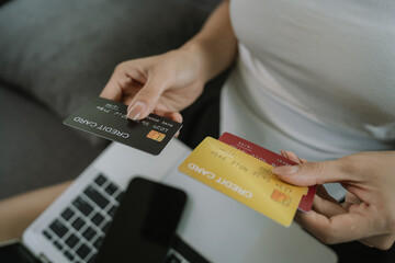 A woman uses her laptop for online banking and payments, managing finances, purchasing goods, transferring money, and exploring digital commerce.