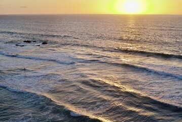 Setting sun reflecting on lines of swell, Playa de La Pared, Fuerteventura