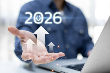 Future growth concept with upward arrows and technology innovation. Business vision, businessman holding virtual 2026, planning and strategic improvement, digital transformation for the upcoming year