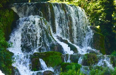 Beautiful waterfalls flows with fresh water in green nature